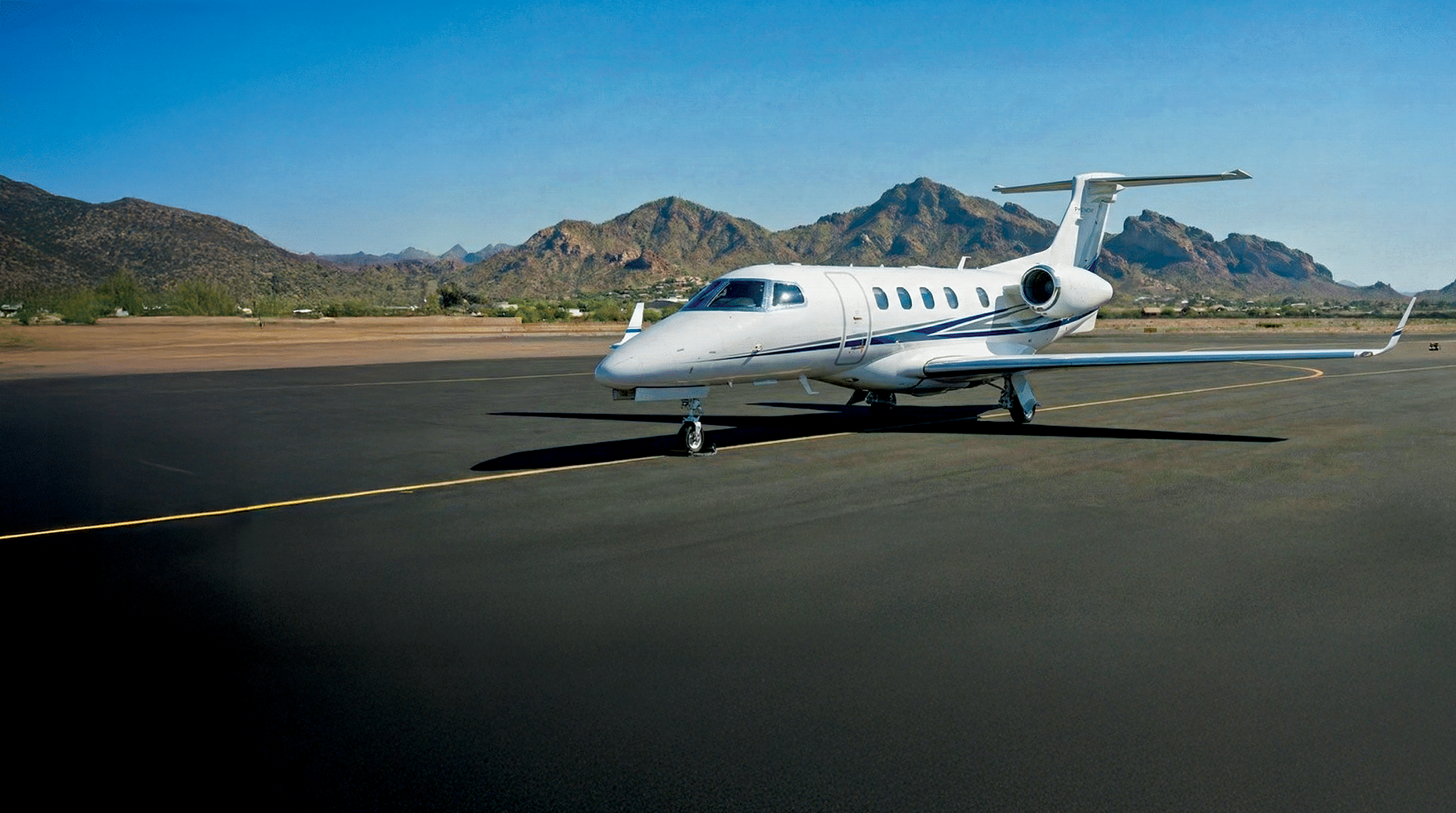 ValleyJet Phenom 300E private jet in desert